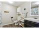 Bright bathroom featuring new cabinets, updated fixtures, and custom wall art at 36901 View Ridge Dr, Elizabeth, CO 80107