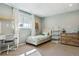 Cozy bedroom with soft colors, large windows, study space, and ample storage at 36901 View Ridge Dr, Elizabeth, CO 80107