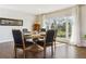 Elegant dining room with a round table, comfortable seating, and a large window showcasing scenic views at 36901 View Ridge Dr, Elizabeth, CO 80107