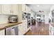 Open-concept kitchen flows into the living area, featuring stainless steel appliances and ample cabinet space at 36901 View Ridge Dr, Elizabeth, CO 80107