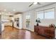 Bright kitchen area with white cabinetry, stainless steel appliances, and a door to a private outdoor deck at 36901 View Ridge Dr, Elizabeth, CO 80107