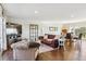 Inviting living room features hardwood floors, ample natural light, and an open layout perfect for modern living at 36901 View Ridge Dr, Elizabeth, CO 80107