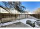 This backyard features a wooden fence for privacy, and a small concrete patio at 15925 E 13Th Ave, Aurora, CO 80011