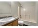 This bathroom is equipped with a shower-tub combo and a well-maintained single sink vanity at 15925 E 13Th Ave, Aurora, CO 80011