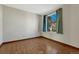 This bedroom features beautiful hardwood floors and a window that provides great natural lighting at 15925 E 13Th Ave, Aurora, CO 80011