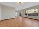 Bright living room with tile floors, large windows, and a sliding glass door for outdoor access at 15925 E 13Th Ave, Aurora, CO 80011
