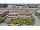 An aerial shot reveals modern condominiums with private balconies, nestled within a vibrant urban neighborhood setting at 3295 Blake St # 301, Denver, CO 80205