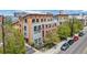 Contemporary multi-level condo with a small gated front yard and private balconies, capturing modern urban living at 3295 Blake St # 301, Denver, CO 80205