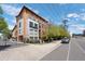 Modern condo building featuring balconies, large windows, and a gated entrance, showcasing contemporary architectural design at 3295 Blake St # 301, Denver, CO 80205