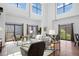 Bright living area features soaring ceilings, expansive windows, hardwood floors, and elegant contemporary furnishings at 3295 Blake St # 301, Denver, CO 80205