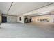 Expansive parking garage provides ample parking space with concrete walls, ceilings, and an open layout at 3295 Blake St # 301, Denver, CO 80205