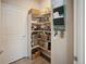 Well-organized pantry with ample shelving for food storage at 27129 E Cedar Ave, Aurora, CO 80018