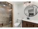 Basement bathroom with a walk-in shower, toilet and vanity at 2805 E 4Th Ave, Denver, CO 80206