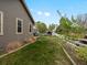 Backyard with green grass, swing set, and patio at 5708 Wetland Loop, Frederick, CO 80504