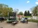 Backyard featuring trampoline, patio, seating and white fence at 5708 Wetland Loop, Frederick, CO 80504