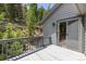 Wood deck outside of home with wood railings at 6882 Snowshoe Trl, Evergreen, CO 80439