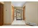 Bright foyer with tile floors, closet, and natural light coming through the front door at 6882 Snowshoe Trl, Evergreen, CO 80439