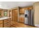 Kitchen with wood floors, stainless steel appliances, and ample cabinet space at 6882 Snowshoe Trl, Evergreen, CO 80439