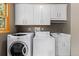 Laundry room with washer, dryer and sink at 6882 Snowshoe Trl, Evergreen, CO 80439
