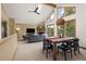 Bright living room with vaulted ceilings, skylight, fireplace and access to balcony at 6882 Snowshoe Trl, Evergreen, CO 80439