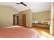 Spacious main bedroom featuring a built-in bench, vaulted ceiling, and wood floors at 6882 Snowshoe Trl, Evergreen, CO 80439