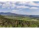 Expansive mountain vista showcasing the natural beauty of the surrounding landscape at 6882 Snowshoe Trl, Evergreen, CO 80439