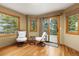 Cozy sitting area adjacent to a balcony with views at 6882 Snowshoe Trl, Evergreen, CO 80439
