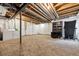 View of the basement with carpet flooring and white walls, with laundry appliances and workout equipment in the room at 23535 E Platte Dr # A, Aurora, CO 80016