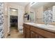 Well-lit bathroom with a double vanity, walk-in closet, and tiled floors for a fresh and modern look at 23535 E Platte Dr # A, Aurora, CO 80016