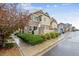 Charming two-story townhouse showcasing stone and siding accents with manicured front yard landscaping at 23535 E Platte Dr # A, Aurora, CO 80016