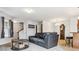Spacious living area showcasing a comfortable sofa, staircase, and stylish decor at 23535 E Platte Dr # A, Aurora, CO 80016