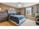 Serene bedroom with plush carpet, a large window, and coordinated furnishings for a restful retreat at 23535 E Platte Dr # A, Aurora, CO 80016