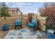 Cozy patio with chairs, a rug, privacy fence and outdoor decor with a view of other units at 23535 E Platte Dr # A, Aurora, CO 80016