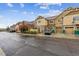 Street view of townhomes, with well-maintained landscaping and attached garages in a desirable neighborhood at 23535 E Platte Dr # A, Aurora, CO 80016