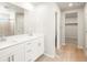 Bathroom with double sink vanity and modern lighting at 583 Homestead Ave, Brighton, CO 80601