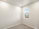 Neutral bedroom featuring a window with blinds, carpet flooring, and freshly painted walls at 583 Homestead Ave, Brighton, CO 80601