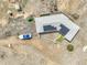Aerial of home with solar panels and boat, surrounded by a spacious yard, shed, and green lawn at 44000 E 88Th Ave, Bennett, CO 80102