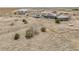 Aerial view of ranch property featuring the home, outbuildings, and boat at 44000 E 88Th Ave, Bennett, CO 80102