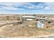 Aerial view of property showing the home, acreage, outbuildings, and boat at 44000 E 88Th Ave, Bennett, CO 80102