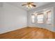 Bright bedroom featuring hardwood floors, bay windows and decorative ceiling fan at 44000 E 88Th Ave, Bennett, CO 80102