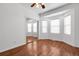 Bright bedroom with hardwood flooring and a mirrored closet, creating a spacious feel at 44000 E 88Th Ave, Bennett, CO 80102
