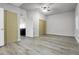 Bright bedroom featuring laminate wood flooring, natural light, large closets, and versatile modern design at 44000 E 88Th Ave, Bennett, CO 80102