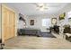 Finished bedroom with vinyl floors, natural light, comfortable bed, desk area, and modern design at 44000 E 88Th Ave, Bennett, CO 80102