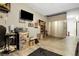 Spacious game room with wood-look floors, large TV, mini fridge, ample space for entertainment and relaxation at 44000 E 88Th Ave, Bennett, CO 80102