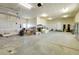 Spacious garage with concrete floors, lighting, and ample room for storage at 44000 E 88Th Ave, Bennett, CO 80102