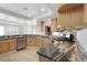 Well-lit kitchen featuring stainless steel appliances, modern countertops, and ample cabinet space at 44000 E 88Th Ave, Bennett, CO 80102
