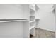 A large walk-in closet with built-in shelving and hanging rods providing ample storage at 44000 E 88Th Ave, Bennett, CO 80102