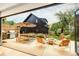 Outdoor patio features dining space, grill, firepit, and garden at 1983 S Logan St, Denver, CO 80210
