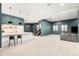 Finished basement featuring bar, pendant lighting, and comfortable seating area at 1983 S Logan St, Denver, CO 80210