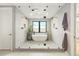 Luxurious bathroom featuring a freestanding tub, glass shower, and modern fixtures at 1983 S Logan St, Denver, CO 80210